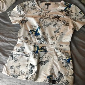 Jaanuu Peplum scrub top